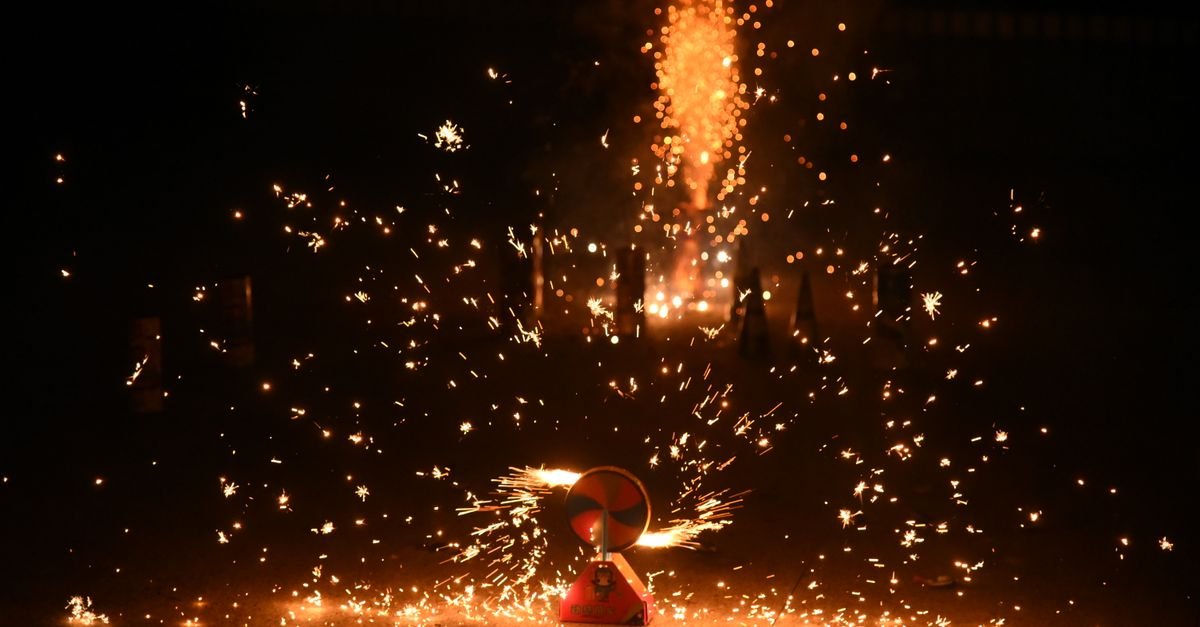 1.4G consumer fireworks aerial burst lighting up the night sky