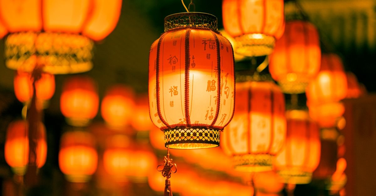 Mid-Autumn Festival lanterns and fireworks over a Chinese city